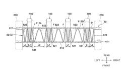 Fixing device having heat roller reinforced by coil