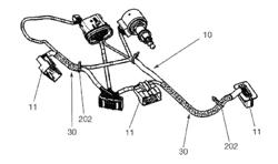 POLYMER PROTECTIVE JACKET FOR ELECTRIC CABLE BUNDLES IN A MOTOR VEHICLE LIGHT DEVICE