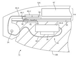 Hinged portable electronic device with display circuitry located in base