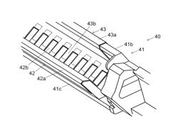 Developing device and image forming apparatus having a collection container with a swing portion