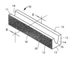 Molten metal-containing vessel, and methods of producing same