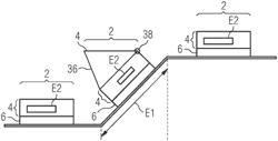 Conveying system having vertically traveling driverless transport vehicles